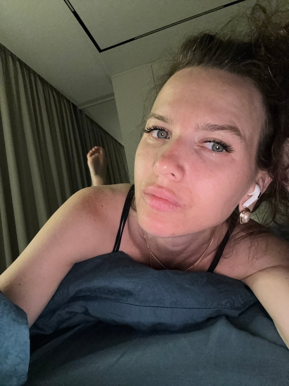 Woman photographed in bedroom during evening hours in Khimki