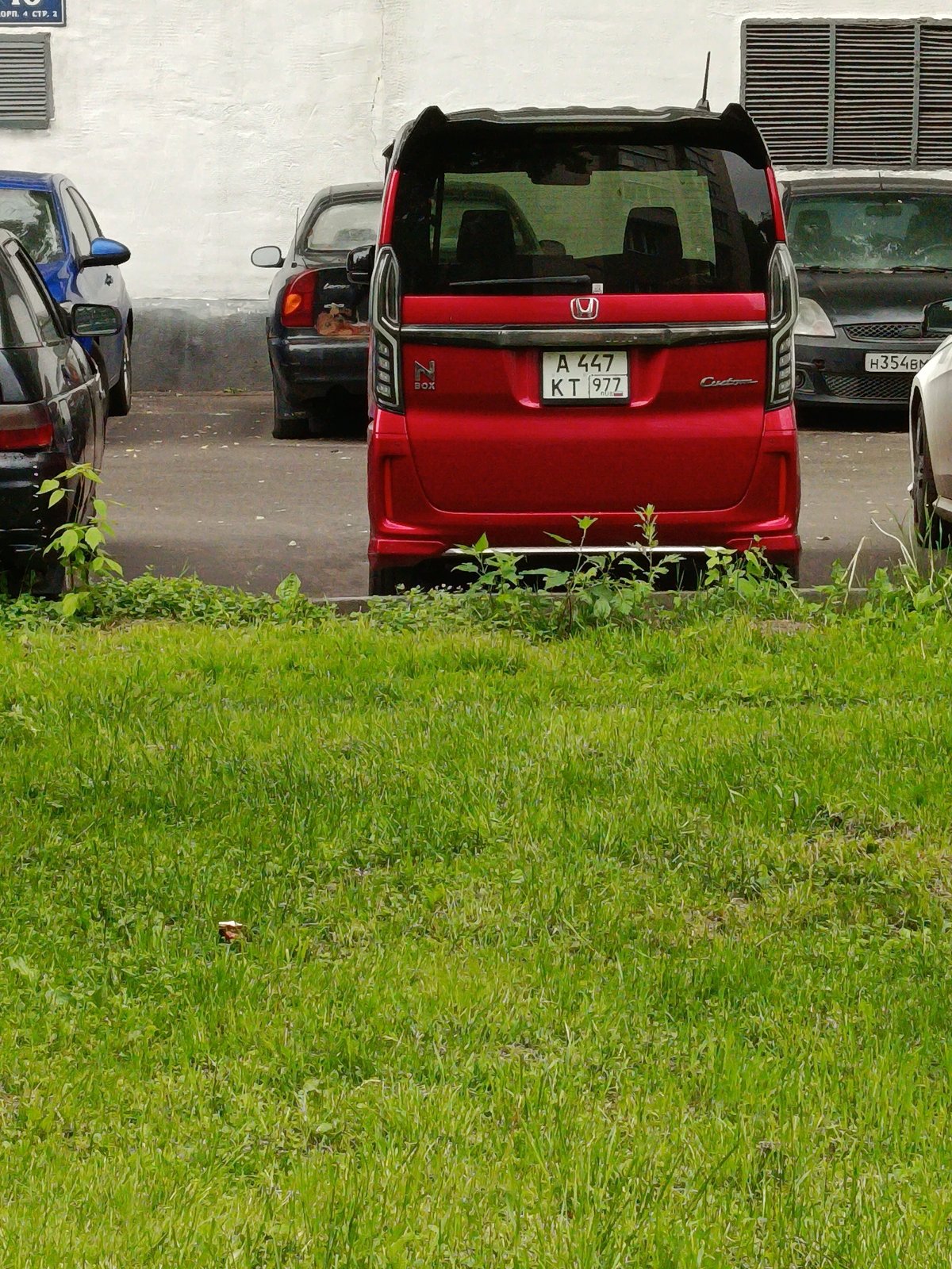 Morning scene of Moscow parking area with green space