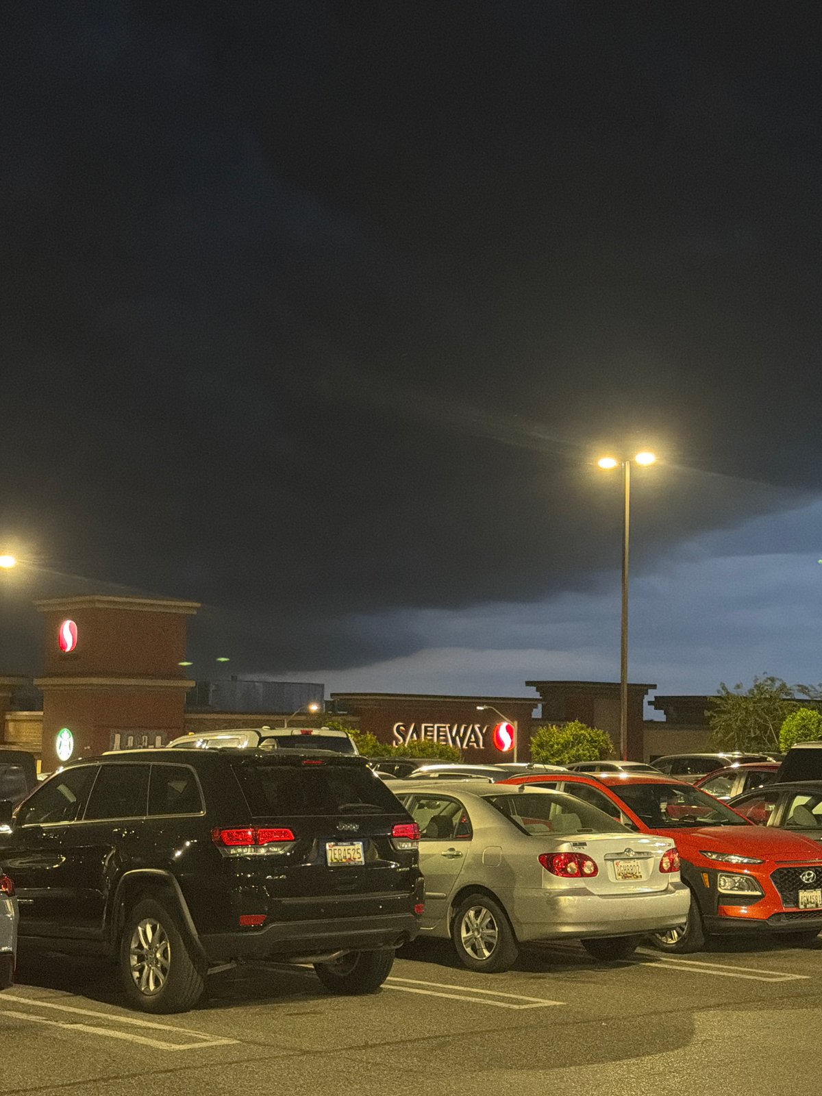 Nighttime parking lot scene documented at Olney Safeway store