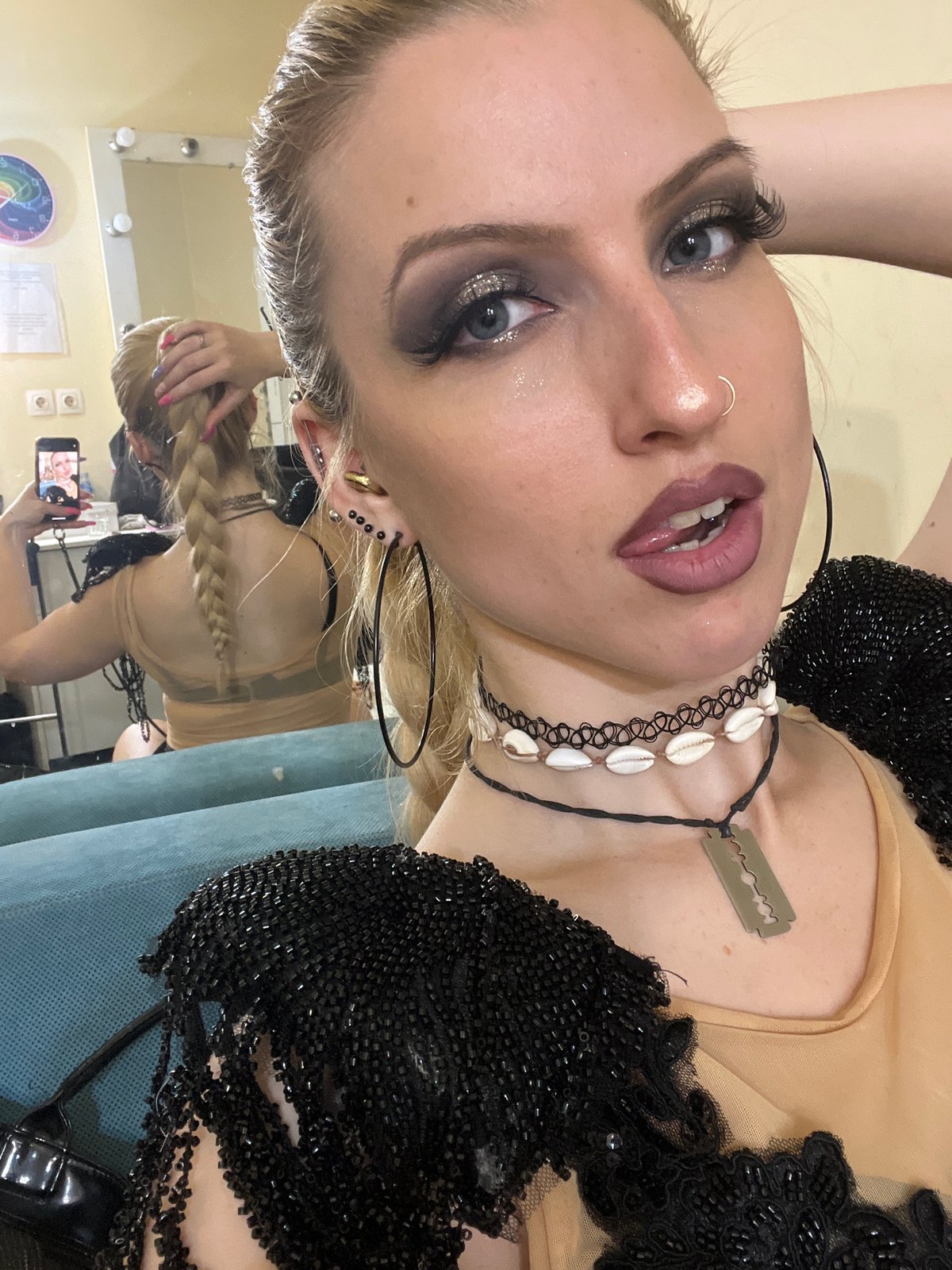 Mirror selfie captured in Plovdiv featuring glittered makeup, jewelry