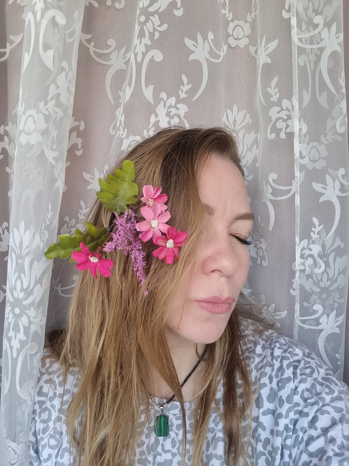 Woman with flower-adorned hair photographed in Chaikovsky portrait session