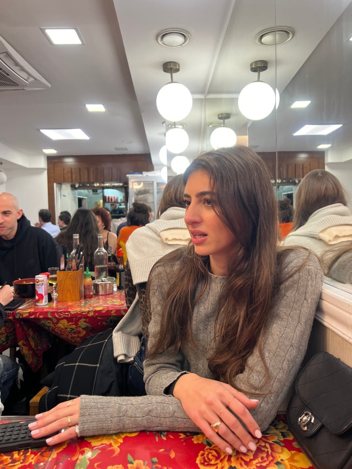 Friends share Asian dinner in Paris restaurant