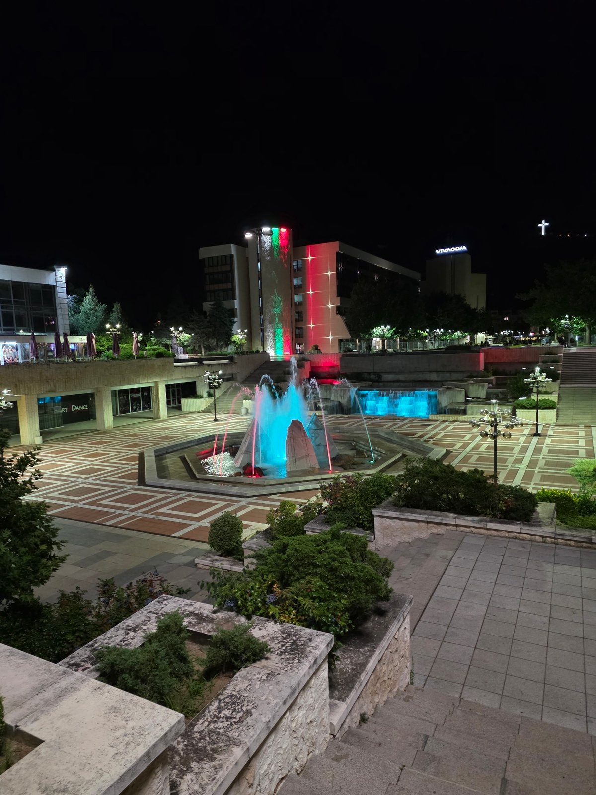 Blagoevgrad's central plaza glows at night with colorful lights