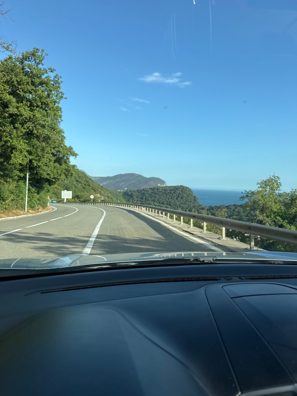 Coastal road view photographed from vehicle near Stupovi, Montenegro