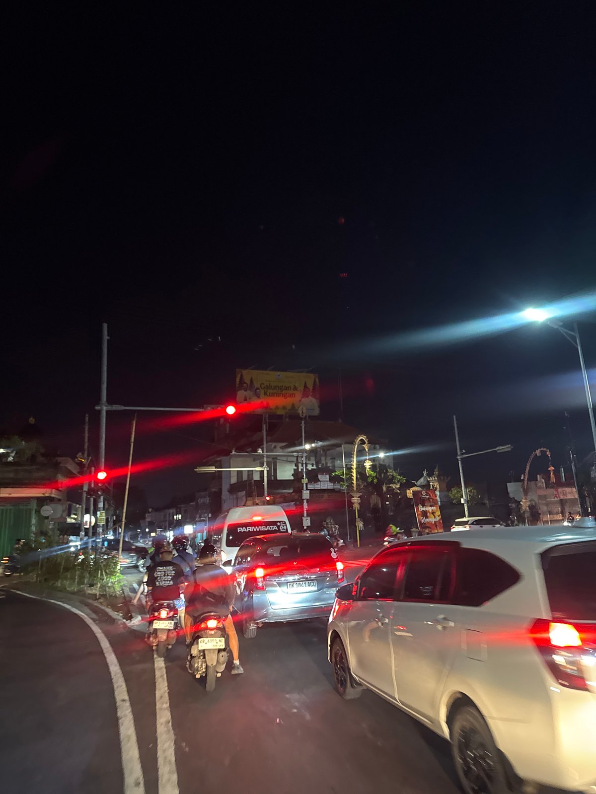 Night traffic moving through North Kuta streets