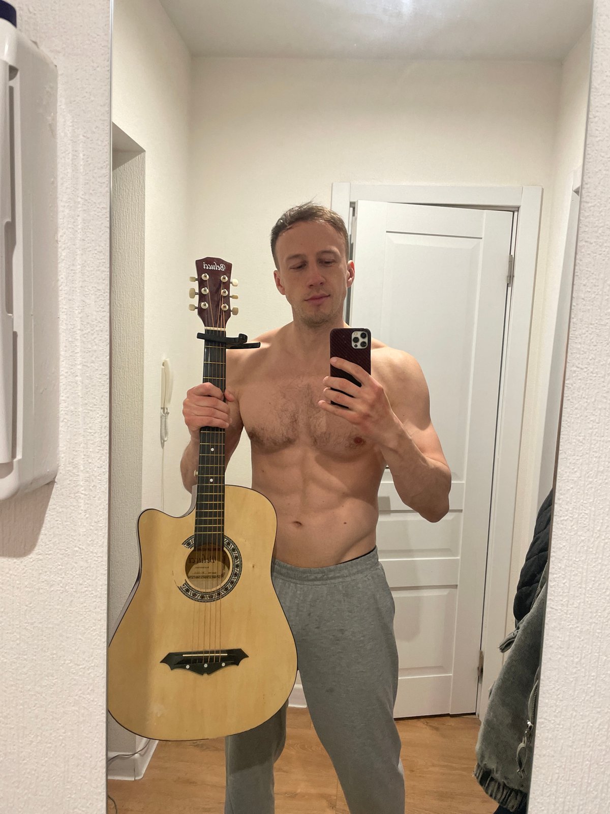 Man Takes Mirror Selfies With Guitar in Saint Petersburg