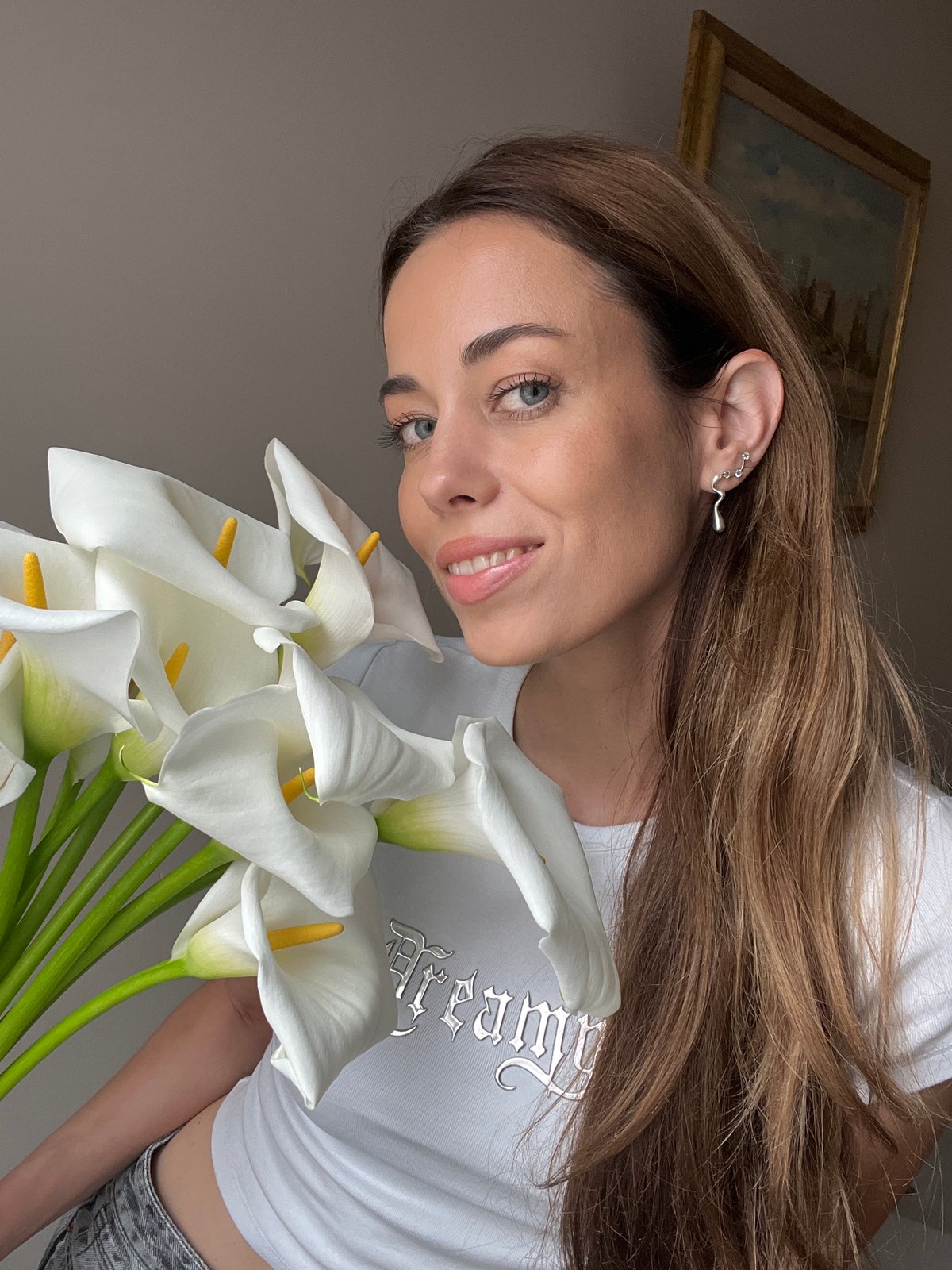 Woman with flowers photographed in Belgrade residential district