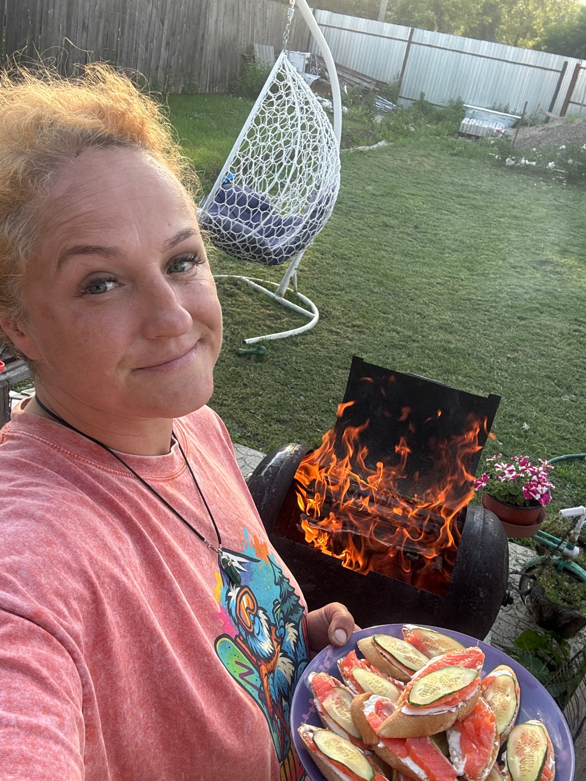 Backyard cookout in Chaikovsky with a boxer dog in tow