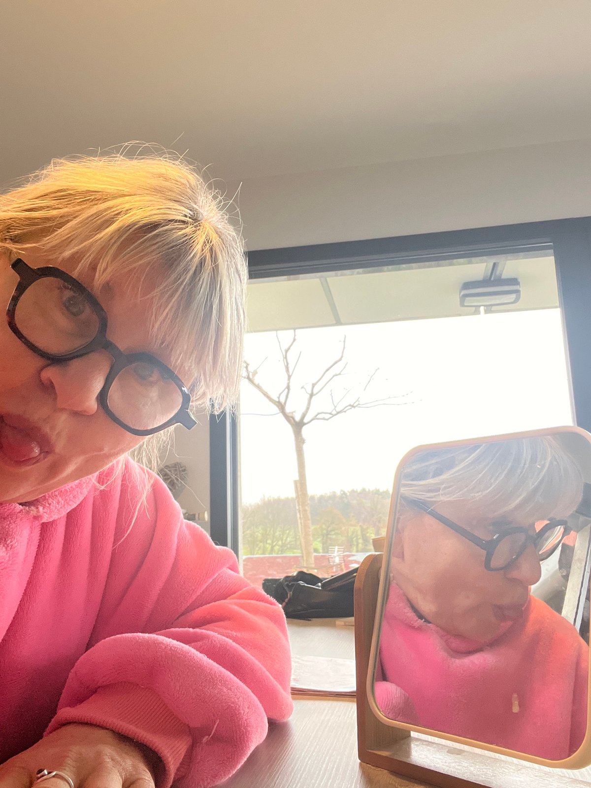 Woman's morning routine with cat and coffee captured