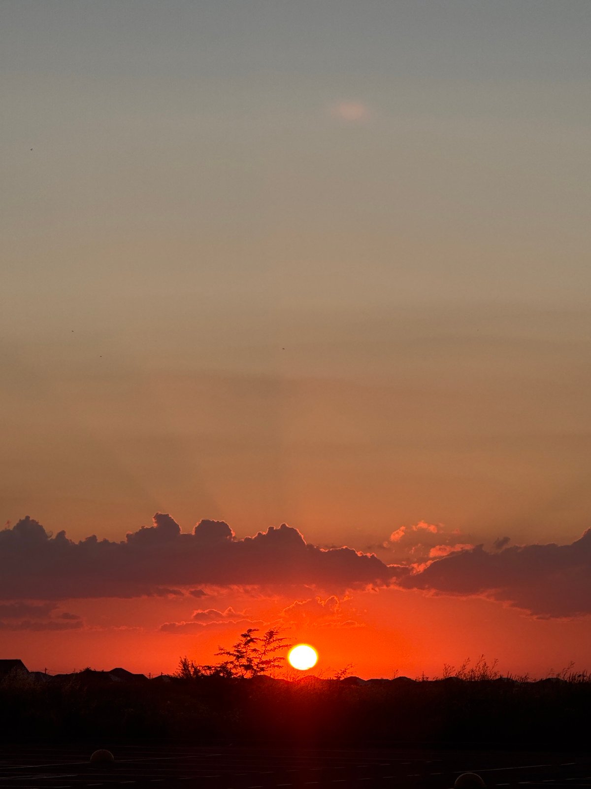 Sunset through clouds and silhouettes, caught from multiple angles