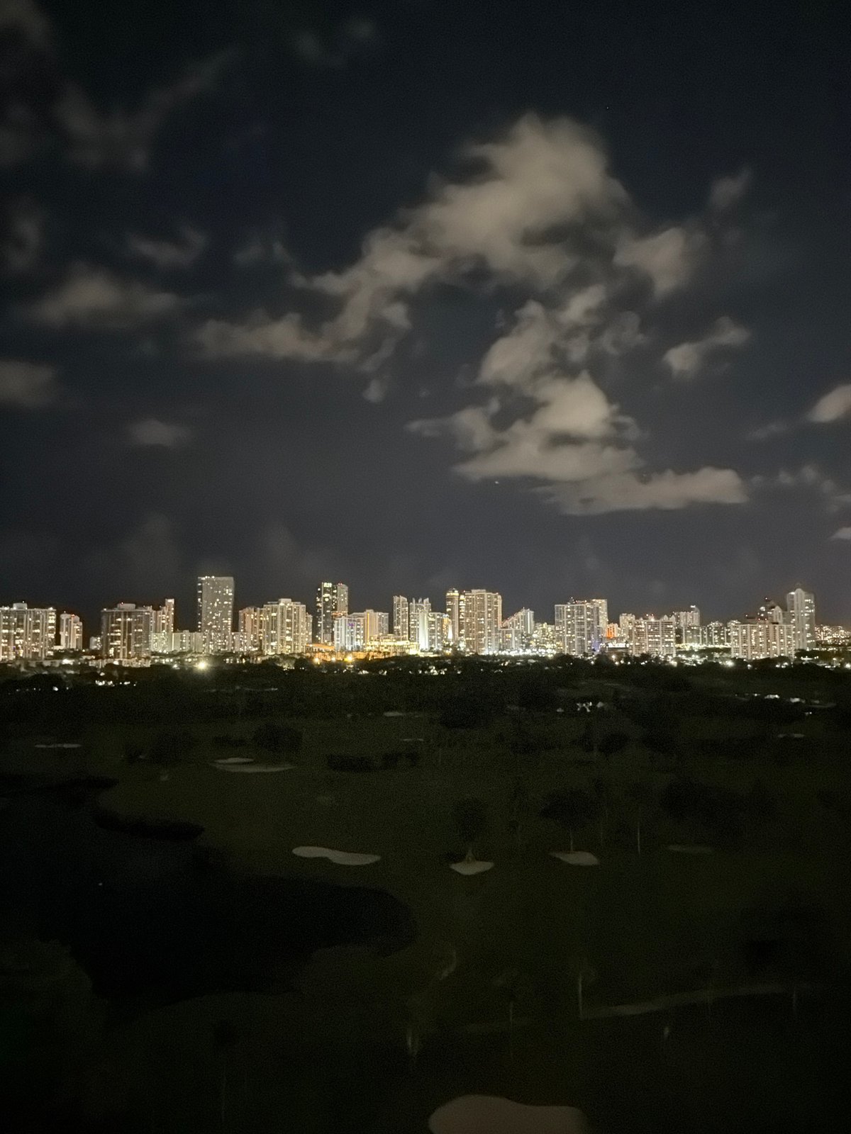 Aventura night: city skyline and sci-fi TV vibes