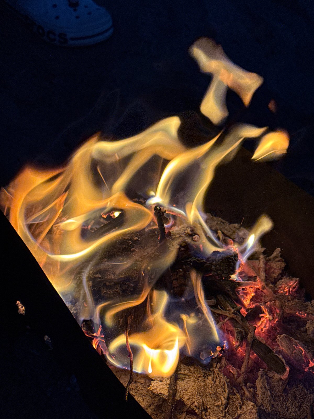 Campfire burning bright on a summer night in Russia