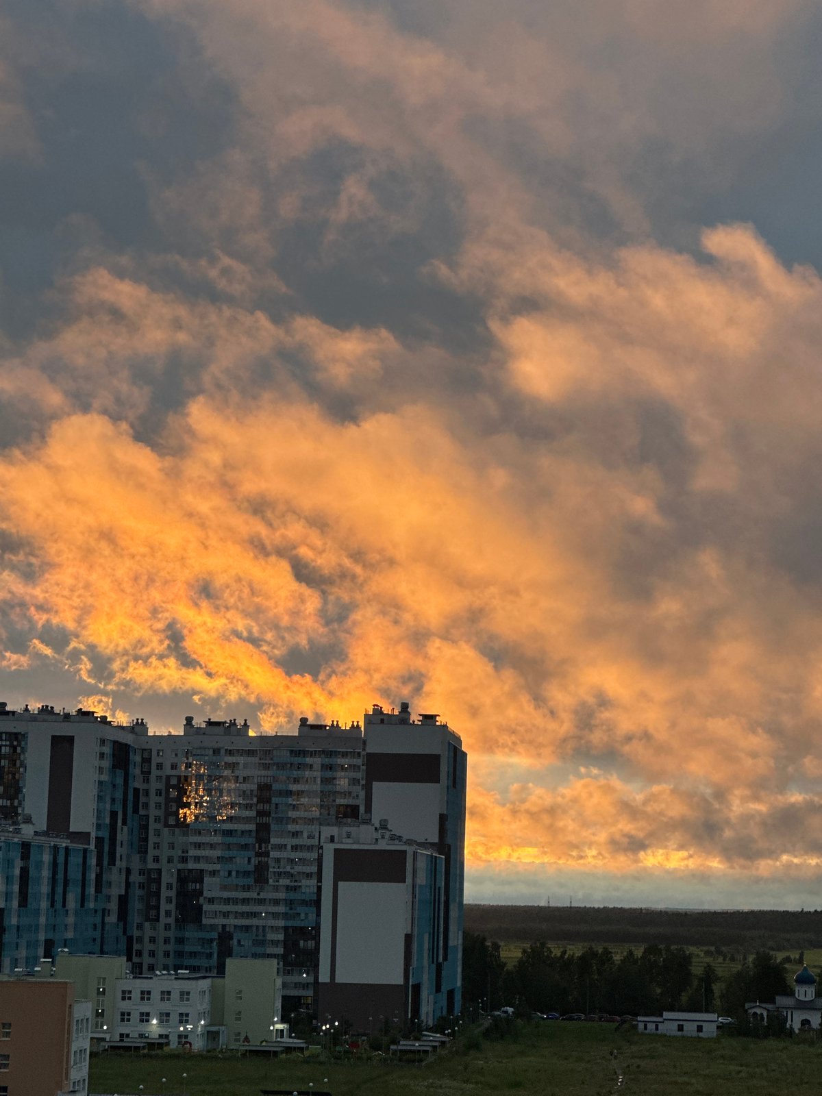 Saint Petersburg residential skyline at golden hour, July 2026