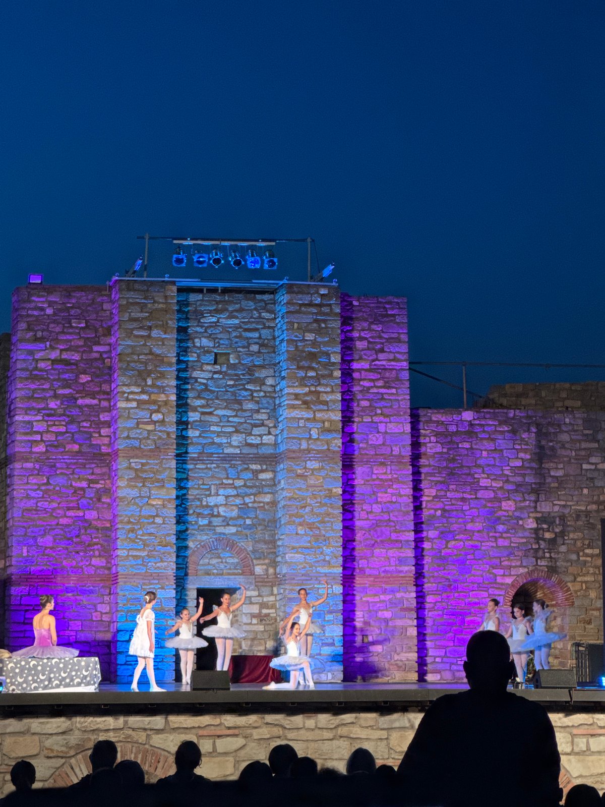 Ballet performed against illuminated stone walls at Tsarevets Fortress