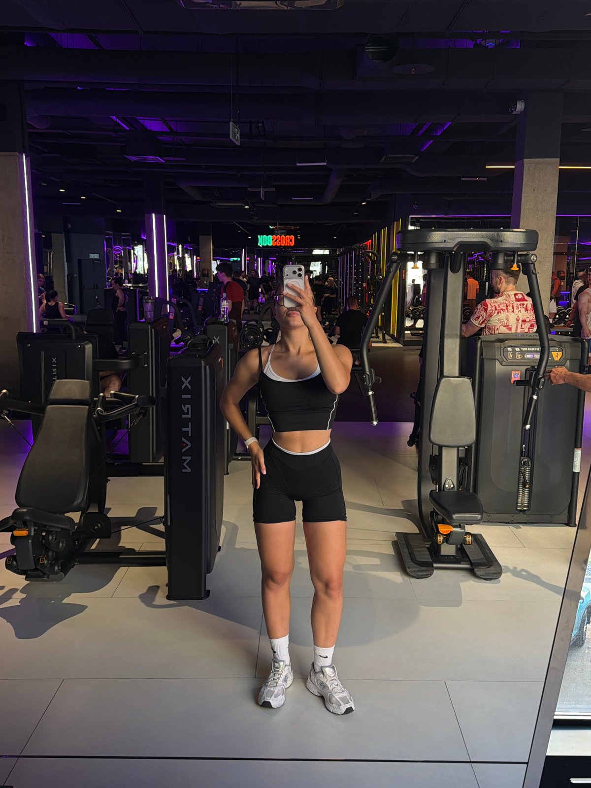 Woman Takes Mirror Selfies at Podolsk Gym
