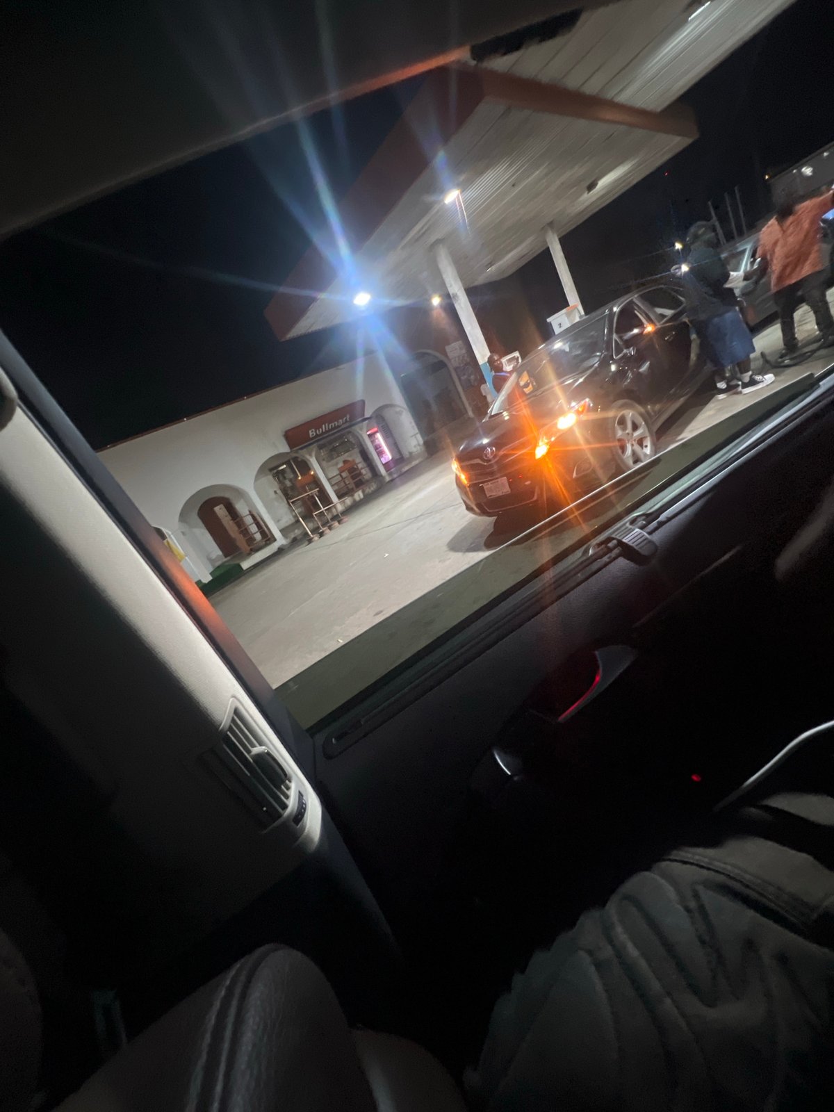 Nighttime urban life documented across Abuja shopping and gathering spots