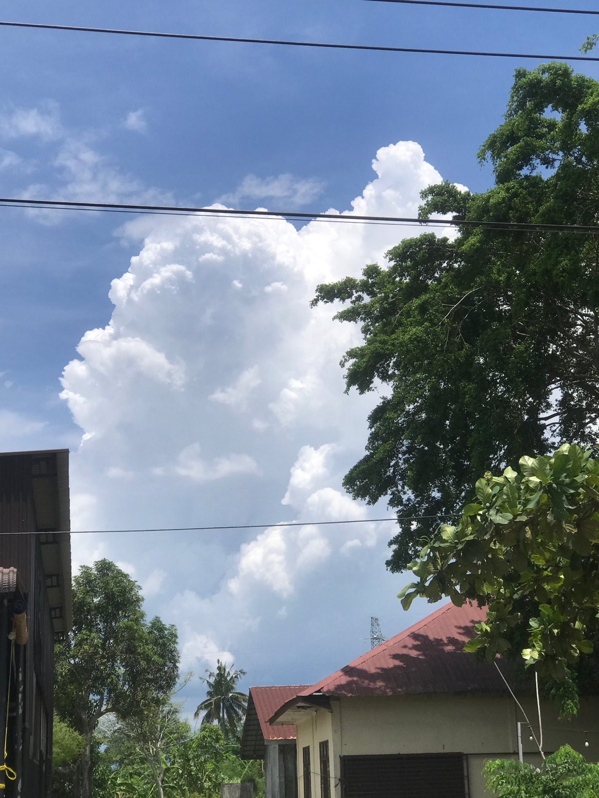 Morning street scenes documented in Lhokseumawe under storm clouds