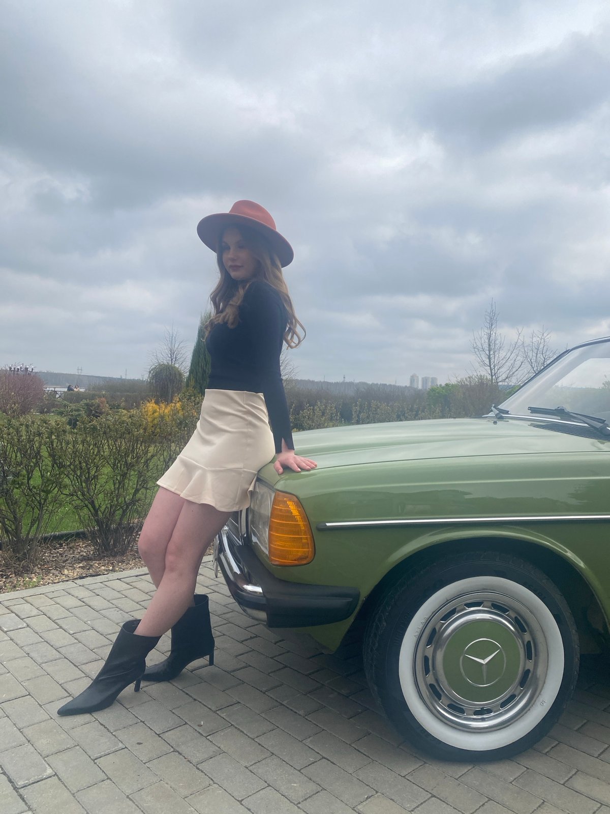 Woman poses with vintage Mercedes-Benz in Yekaterinburg photoshoot