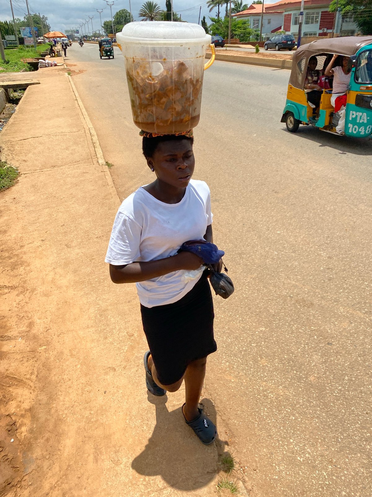 Street vendors and foot traffic on a busy Bukuru morning