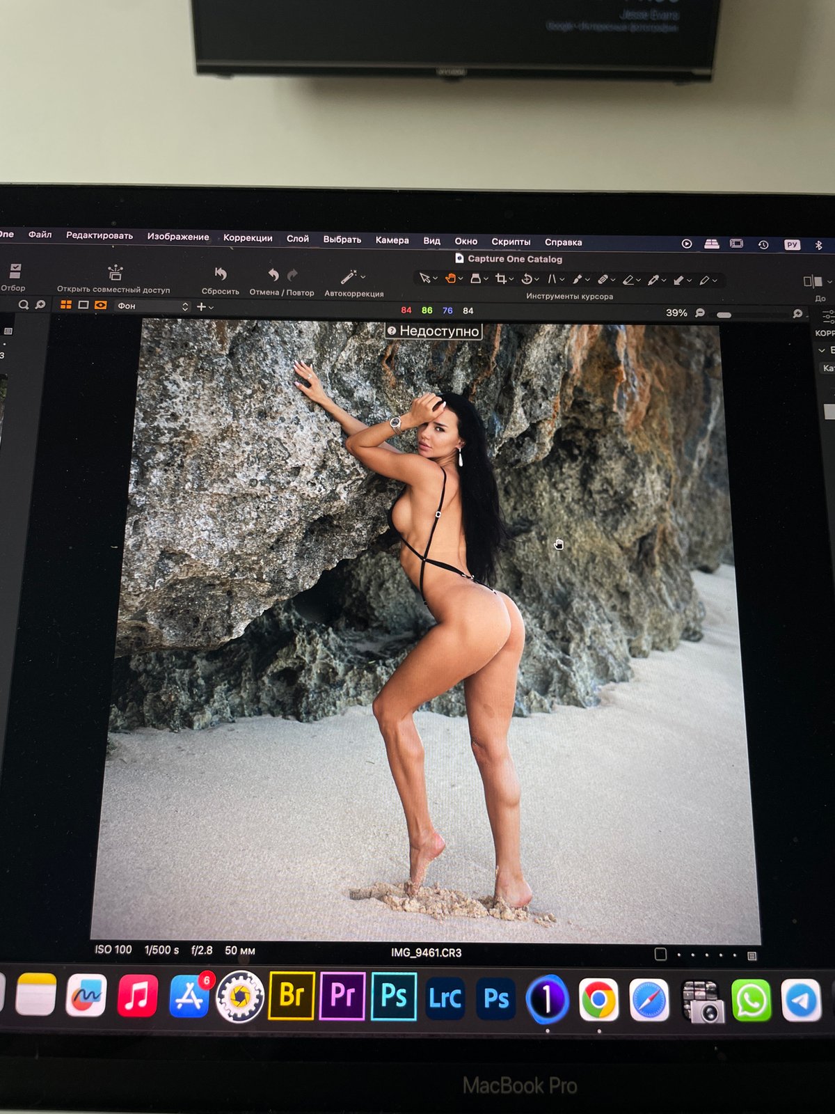 Photo editor processes swimwear photography in Kazan studio session