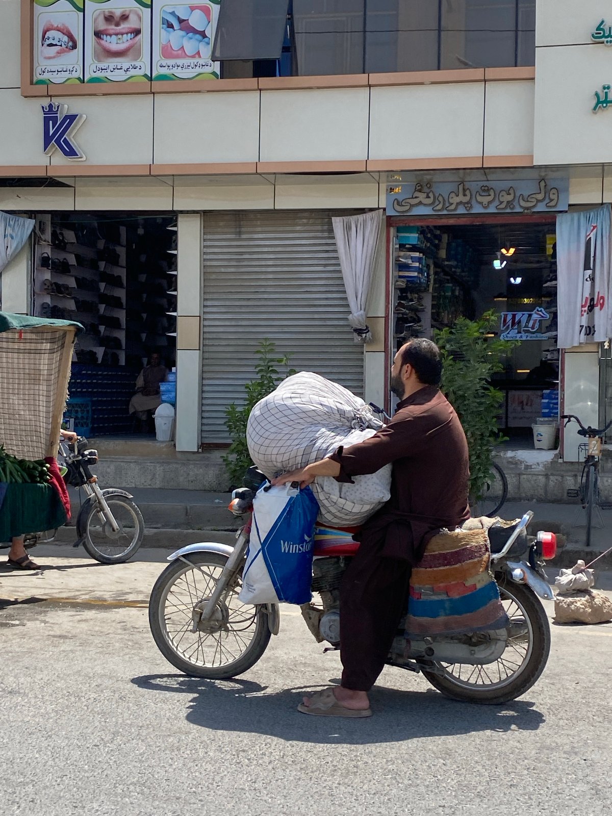 Street life and transit on a Kandahar road