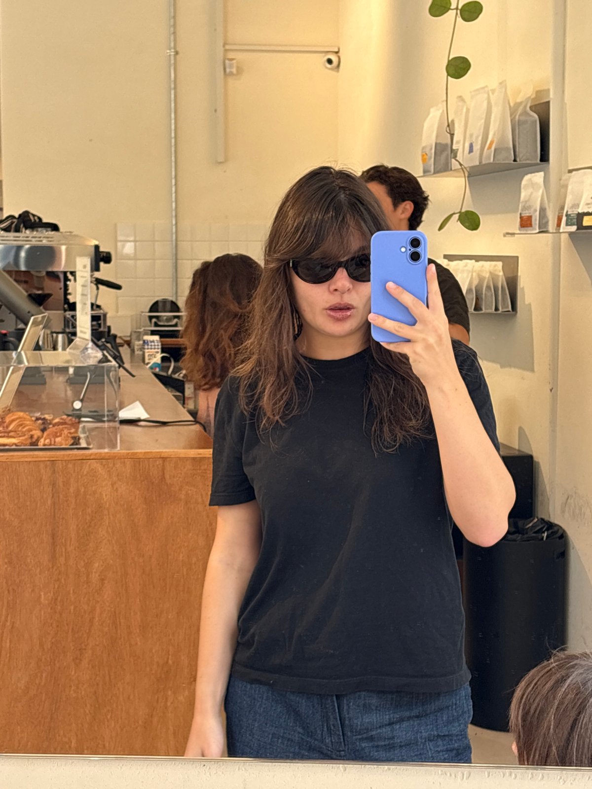 Casual portraits inside a Tel Aviv café, mid-morning.
