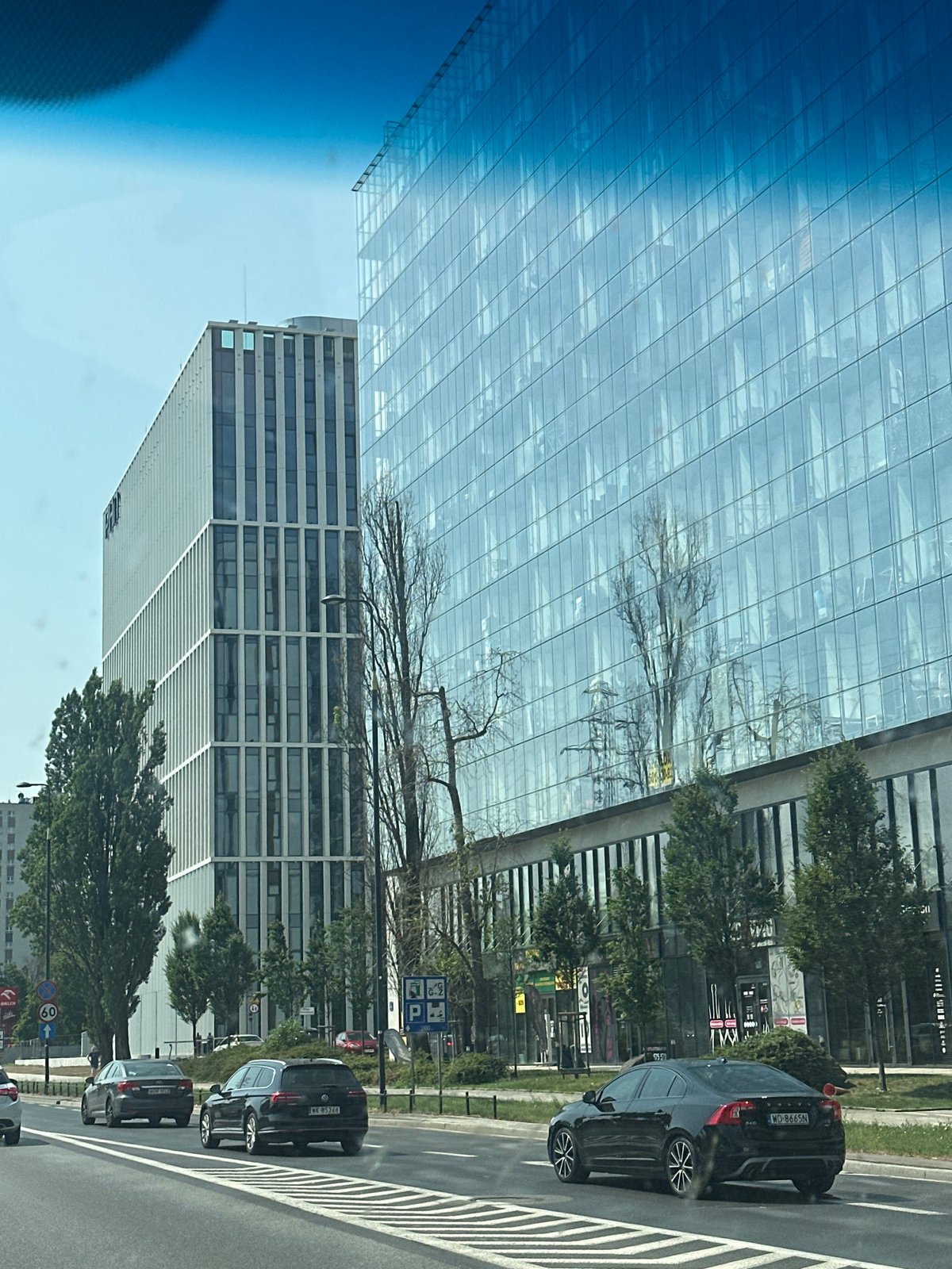 Warsaw's glass office towers seen from a passing vehicle
