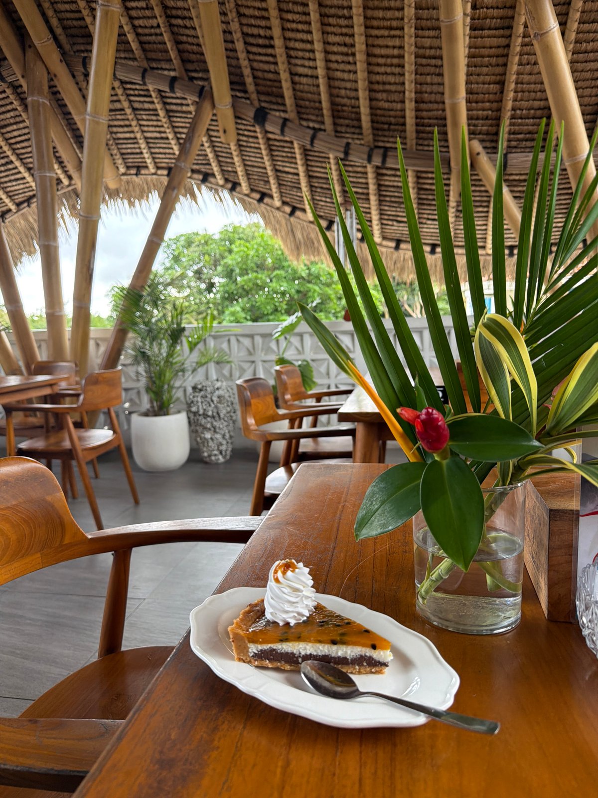 Woman visits traditional bamboo restaurant in Kuta Selatan
