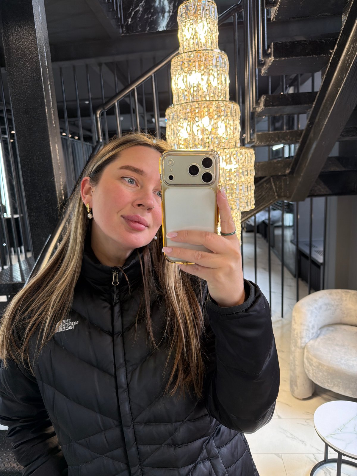 Woman takes selfie on stairs in Moscow building