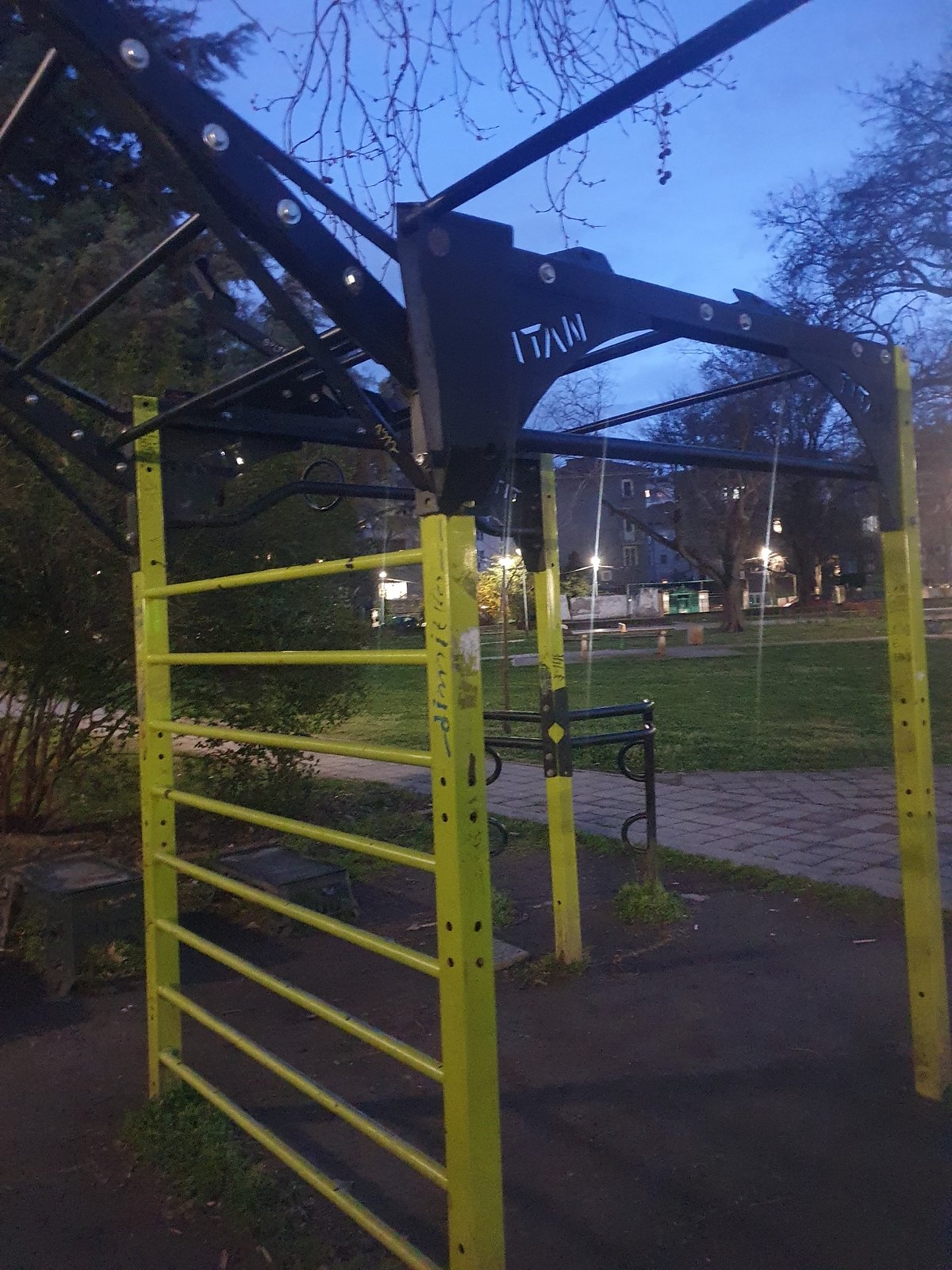 Public park features fitness equipment and bottle cap recycling