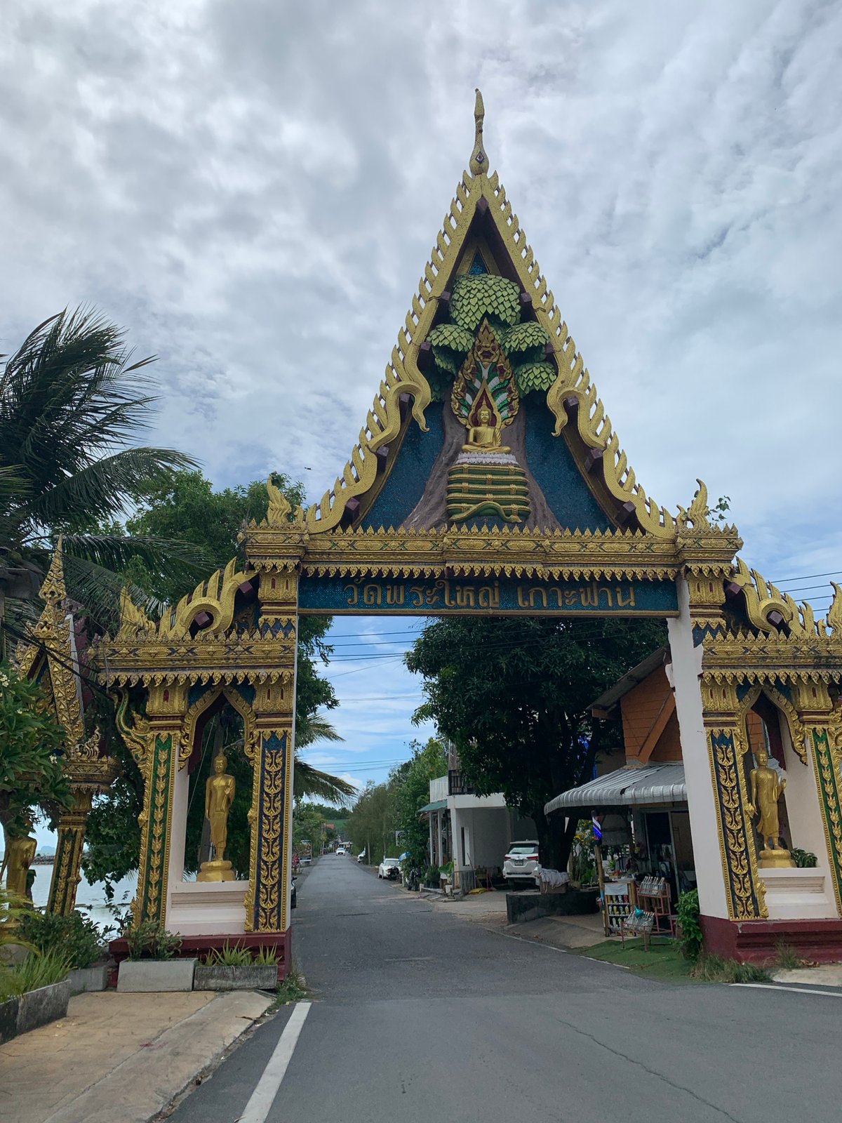 Thai temple architecture and coastline documented in Baan Plai Laem