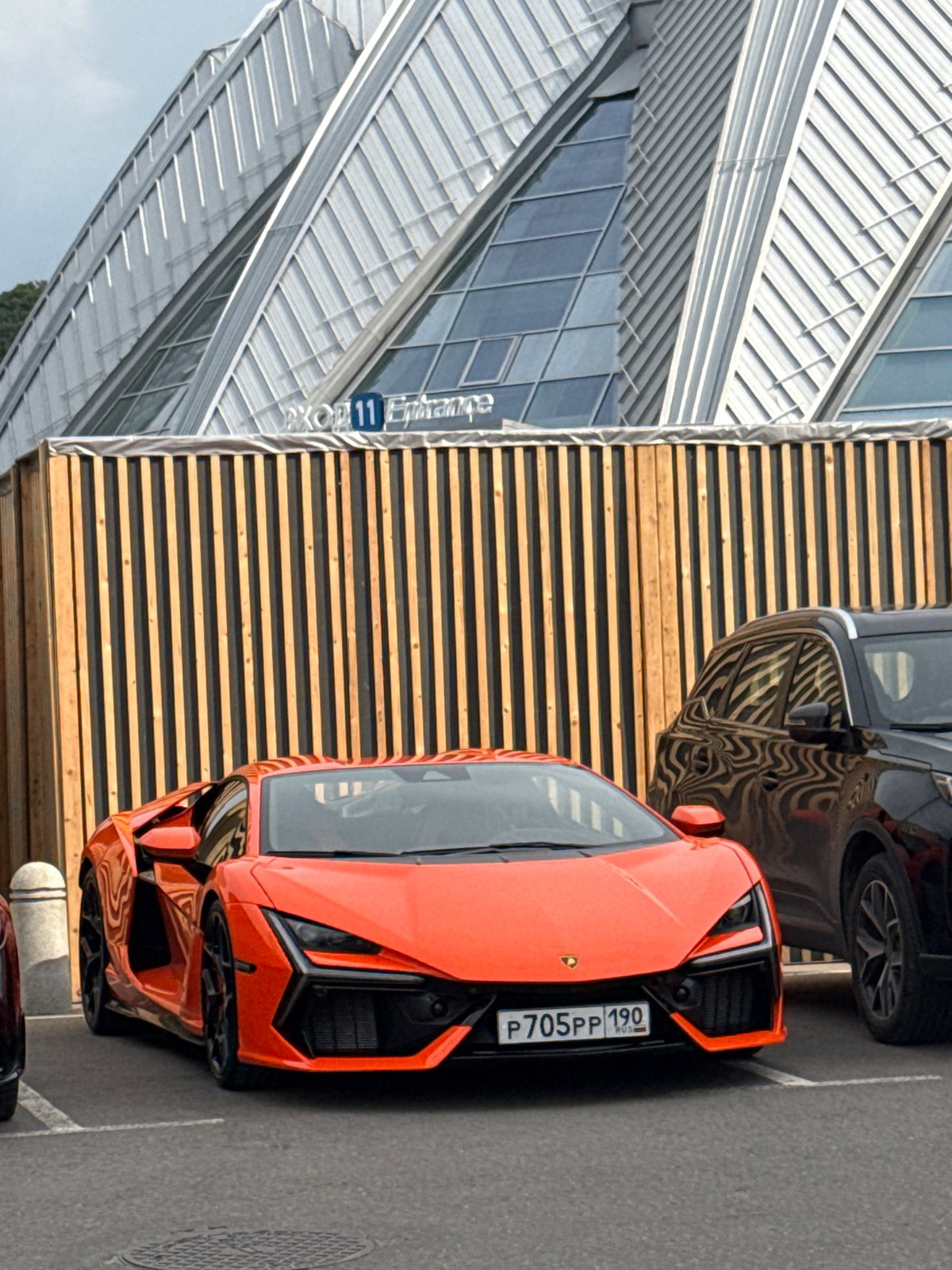 Orange Lamborghini and outdoor event outside a Moscow venue
