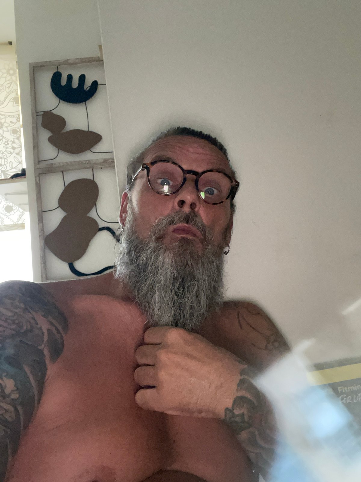 Relaxed indoor selfie session in Netanya, same person, multiple angles.