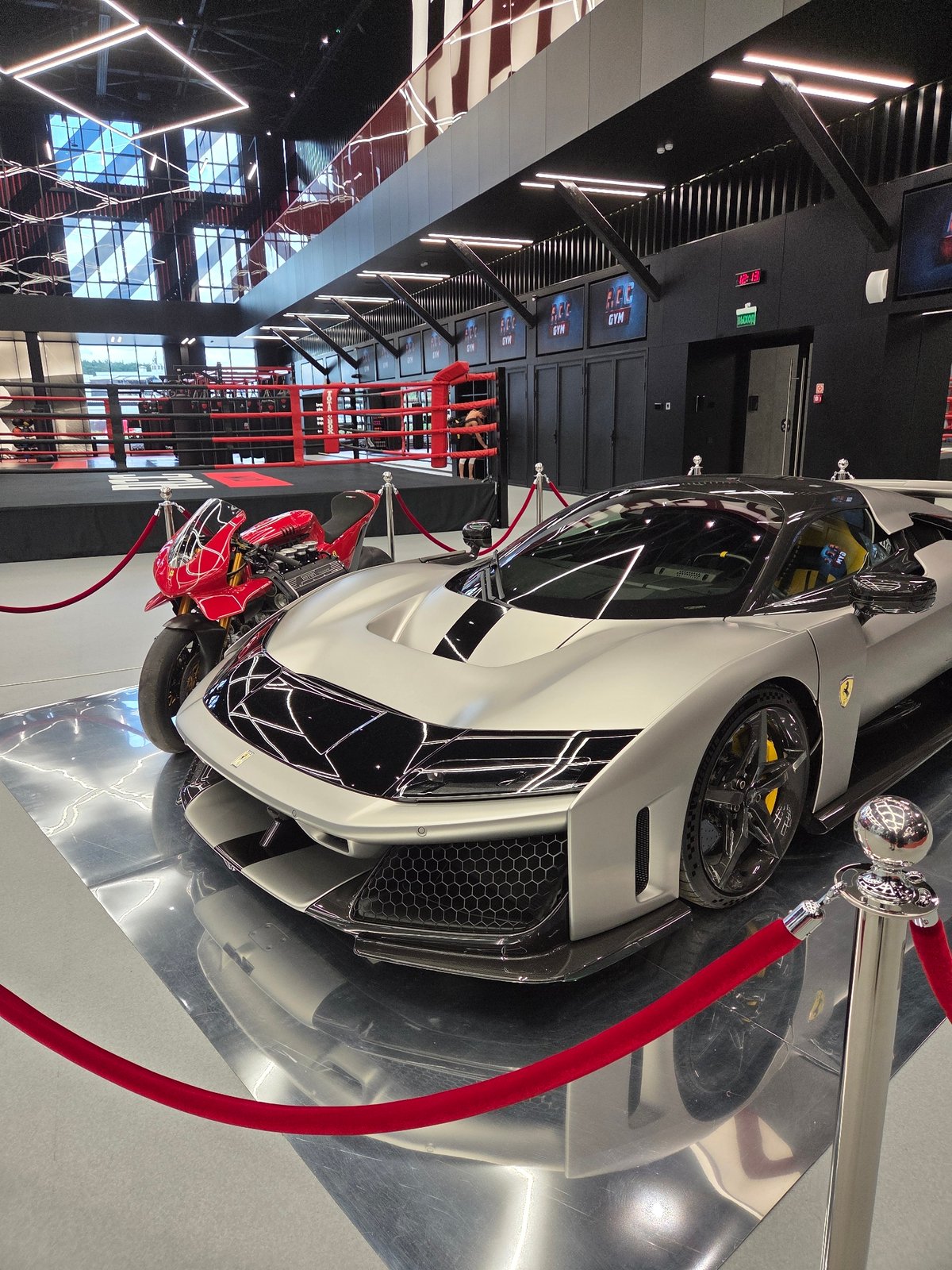 Ferraris on display inside a sleek Yekaterinburg boxing gym