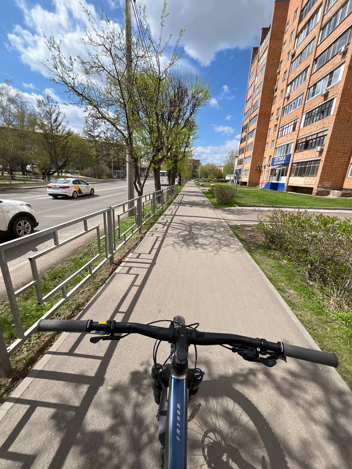 Morning bicycle ride captured on Krasnoyarsk sidewalk
