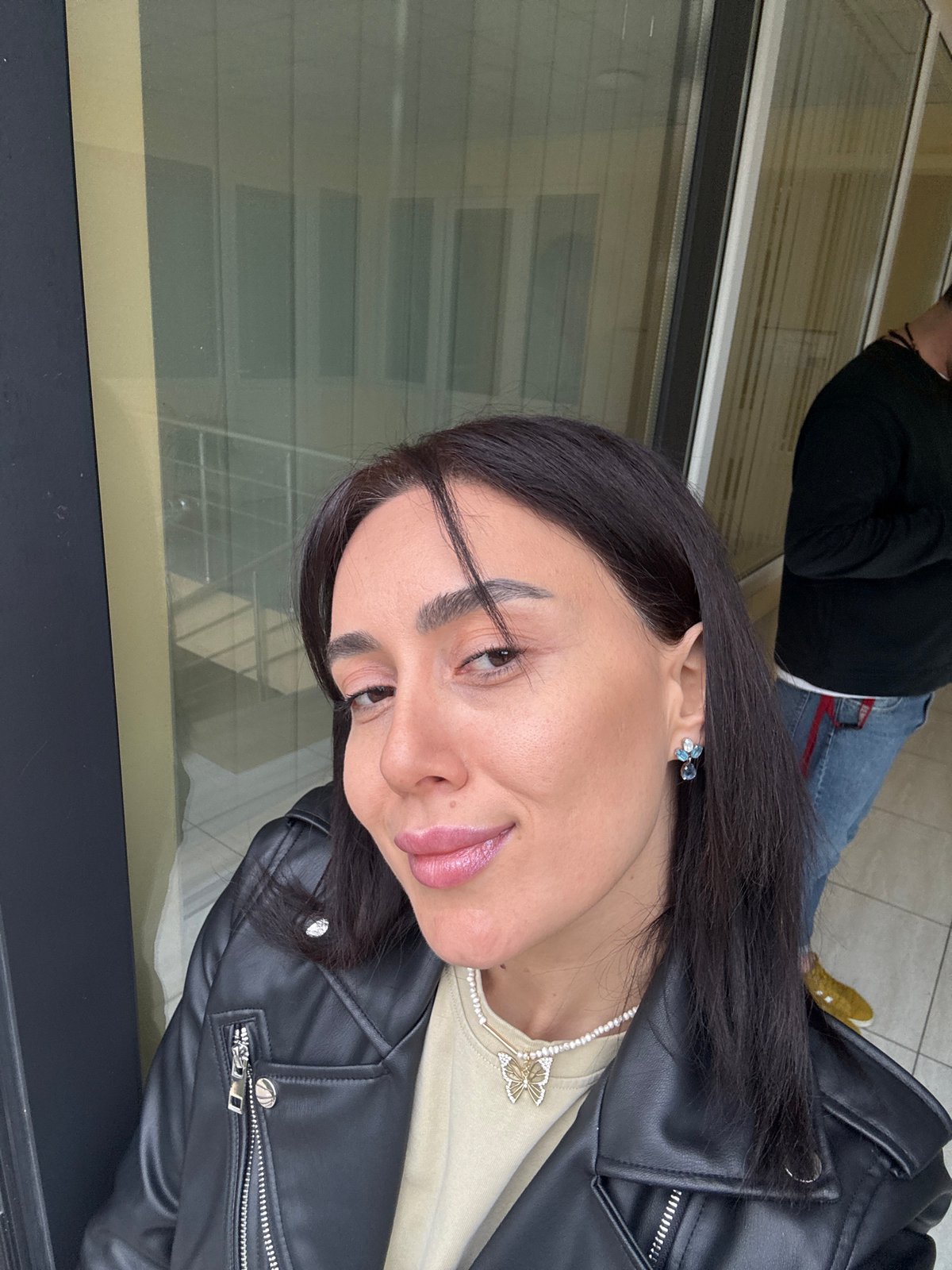 Woman takes multiple selfies in Tbilisi indoor locations