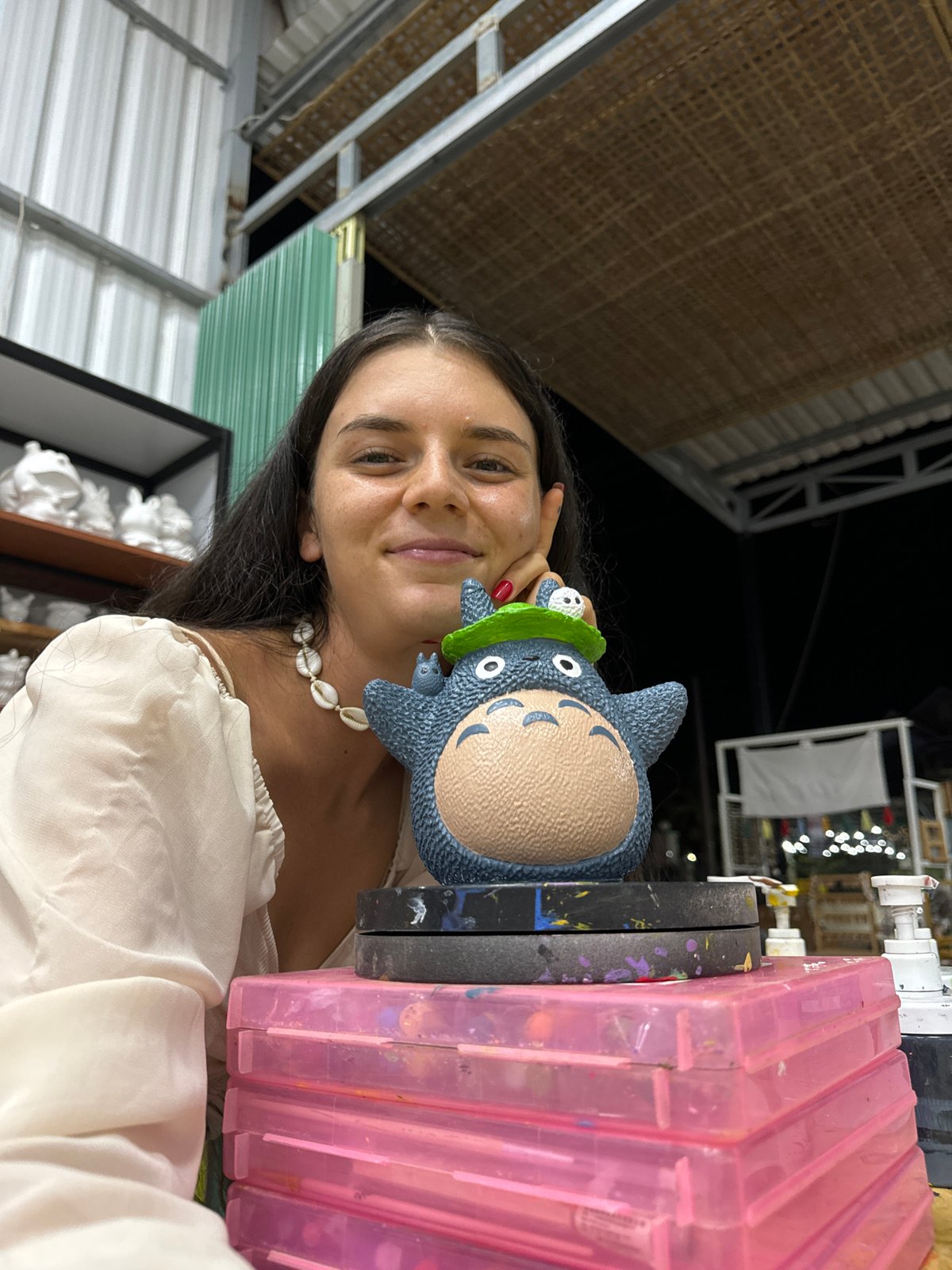 Browsing a Mũi Né art studio with custom Totoro figurines