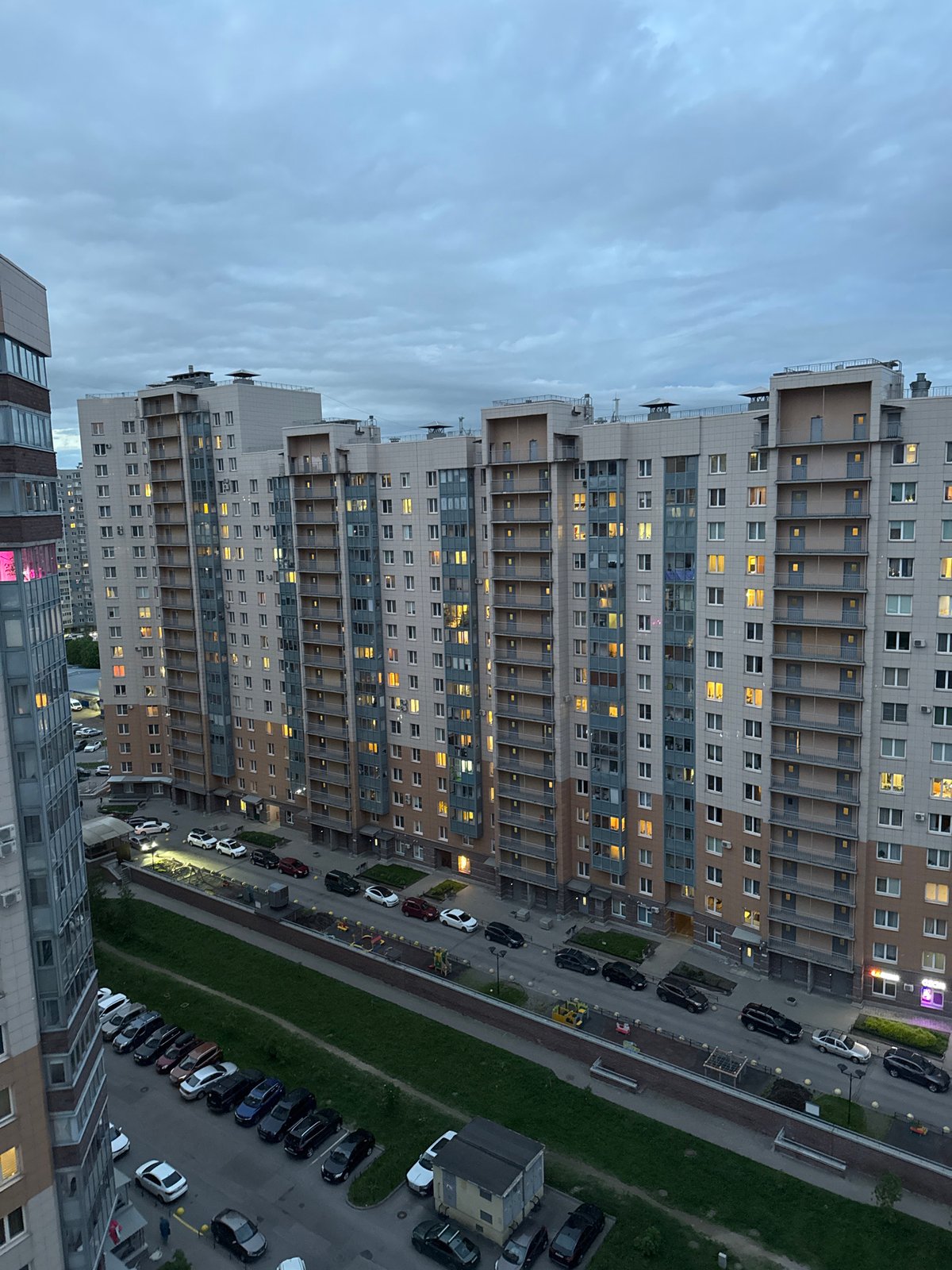 Woman celebrates with wine and cake at Russian apartment