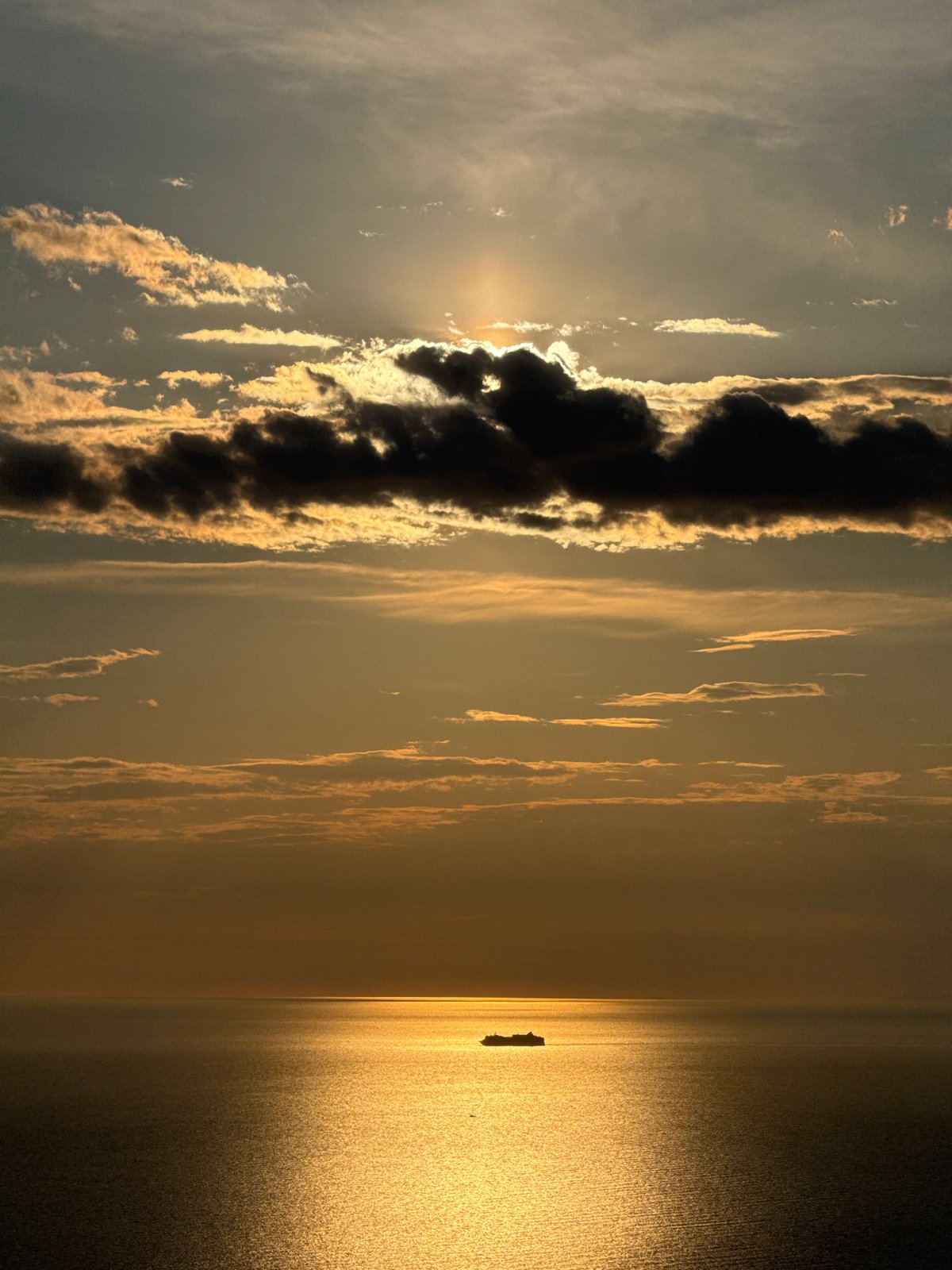 Sunset captured over Montenegro waters with distant island visible