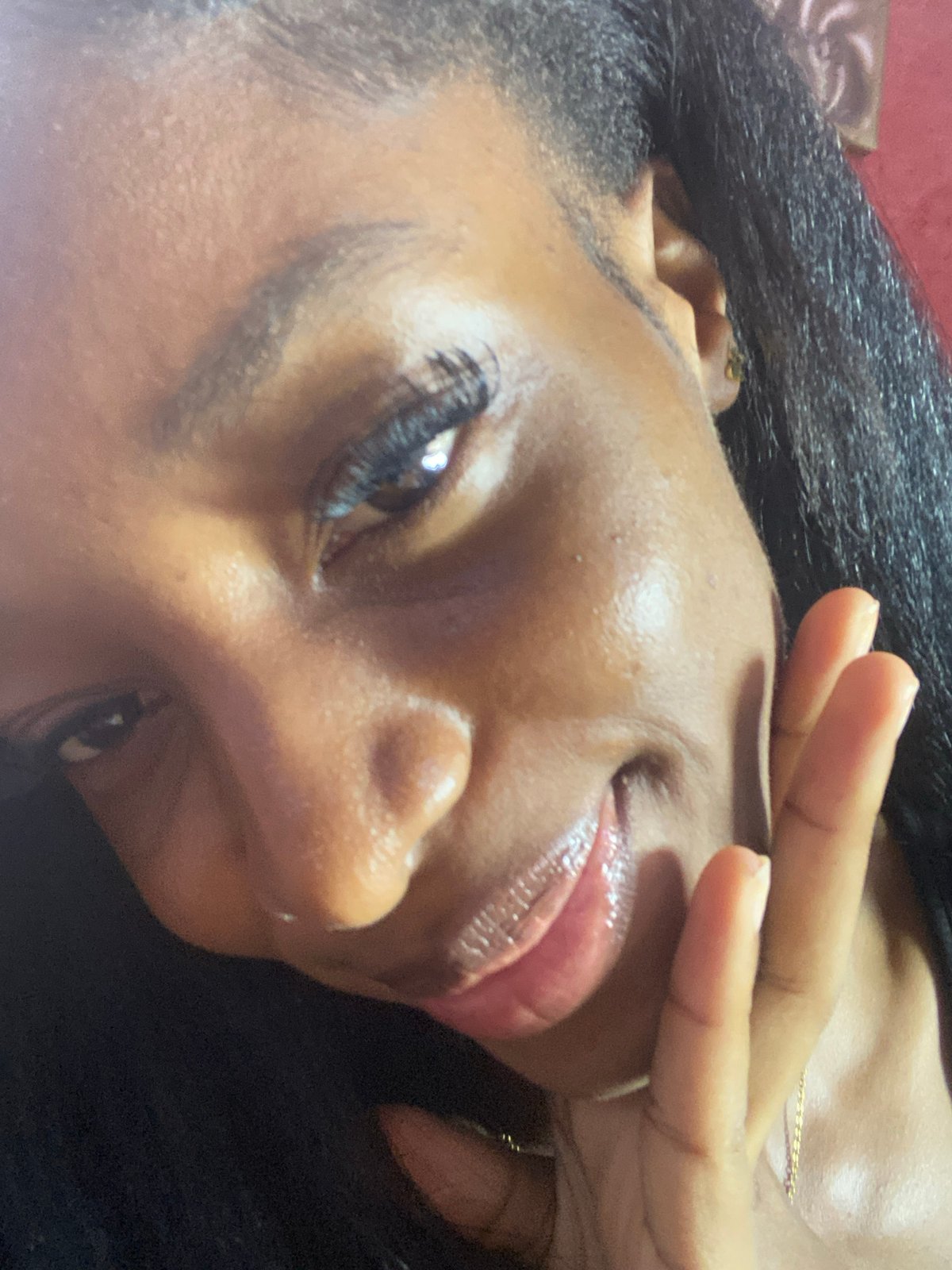 Woman takes selfies during indoor gathering in Jos, Nigeria
