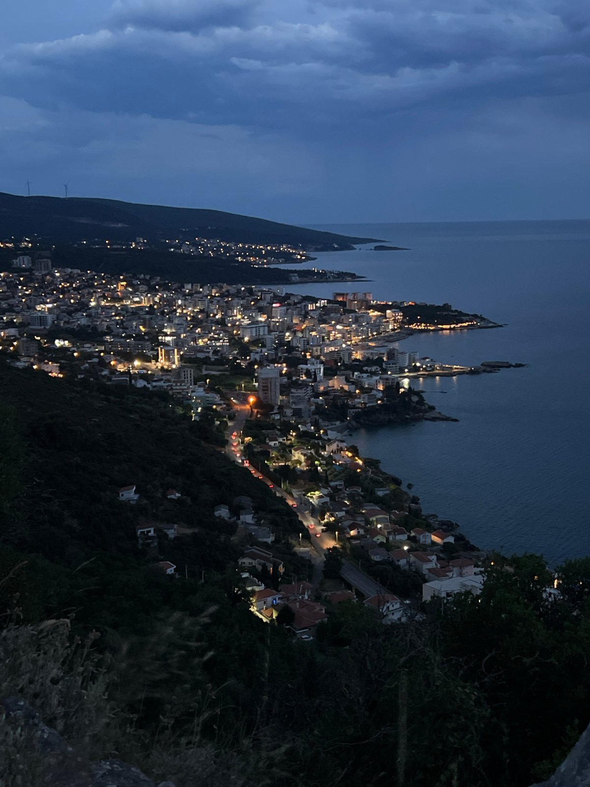 Twilight settles over Dobra Voda's coastal hillside
