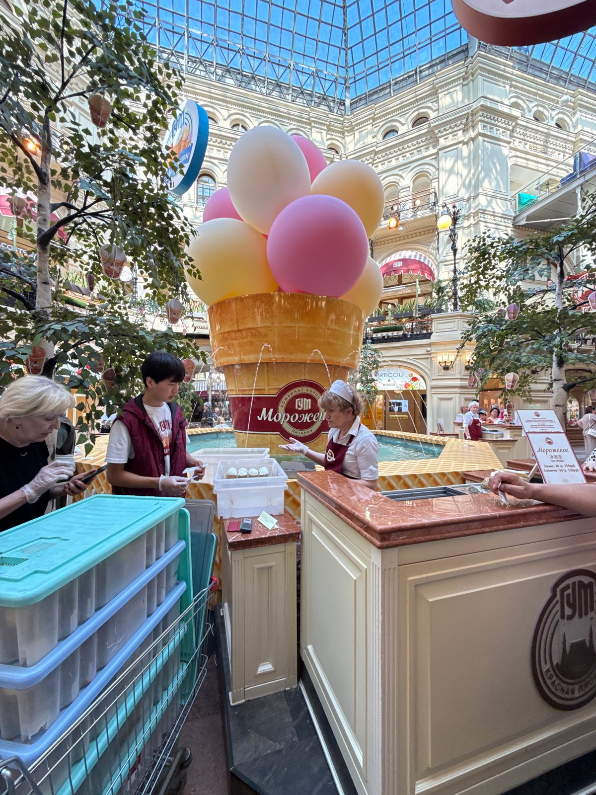 Ice cream vendor serves customers at Moscow's GUM store
