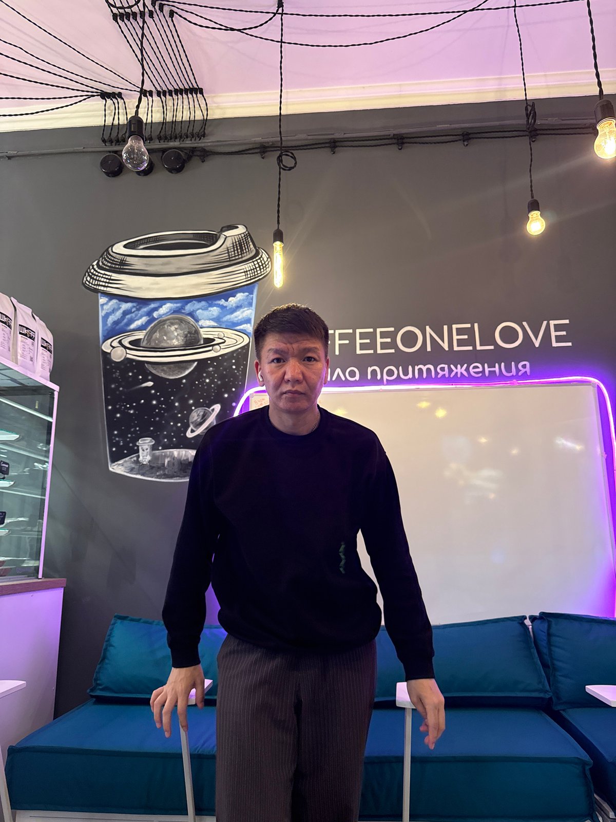 Posing around a trendy Moscow café, July 2026.