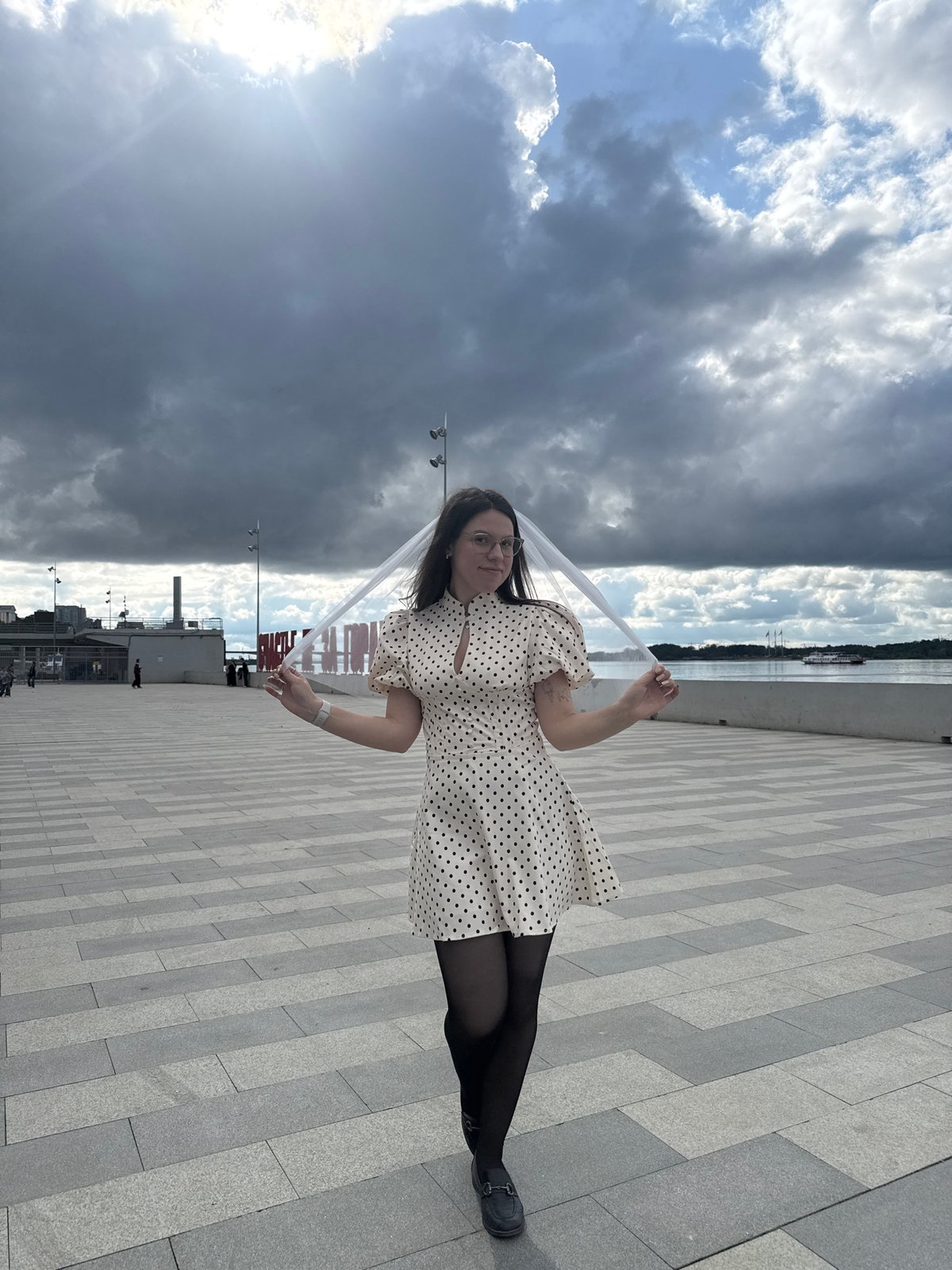 Woman in polka-dot dress photographed around Perm, Russia