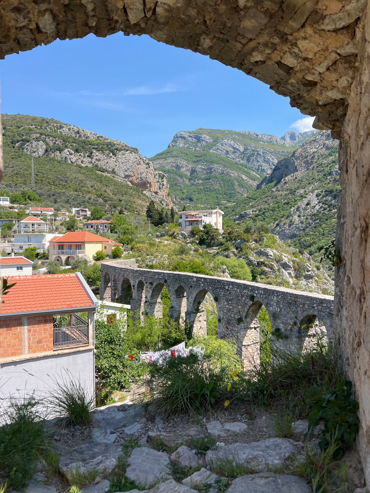 Tourist documents ancient stone ruins in Stari Bar Montenegro
