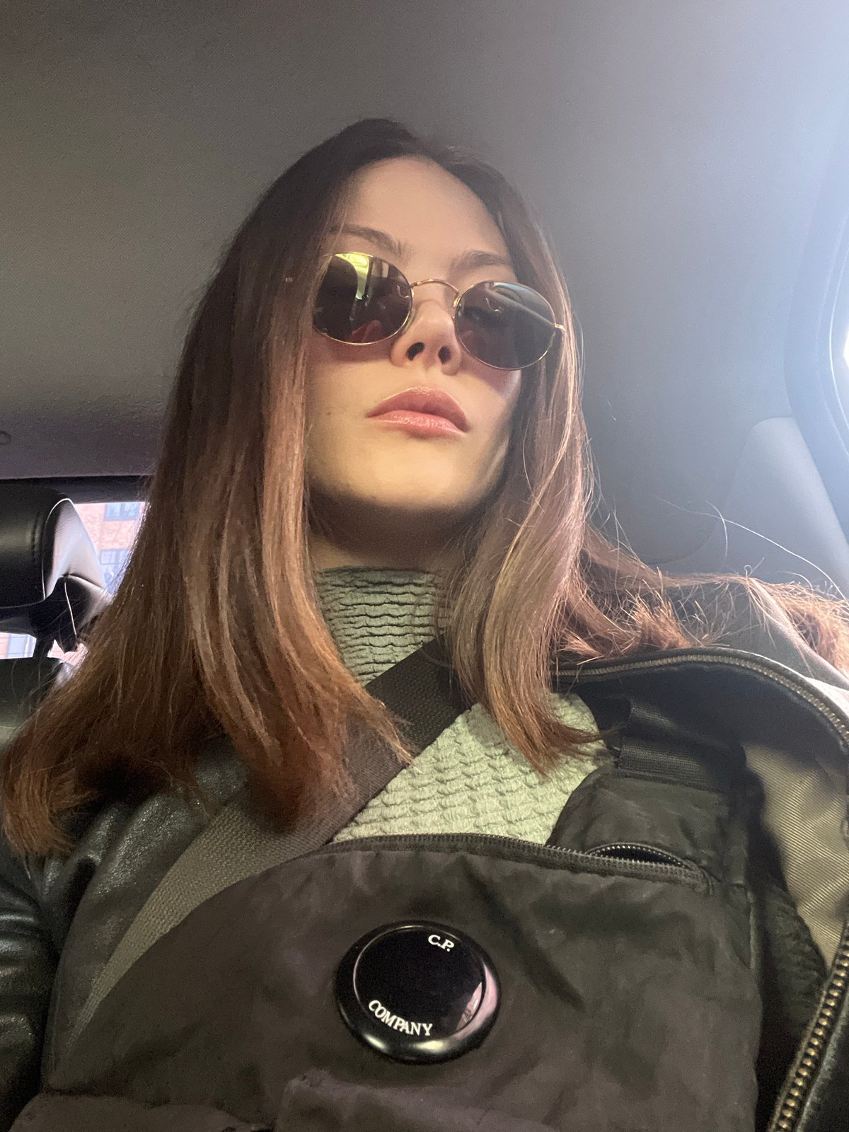 Woman takes selfie in London wearing designer jacket