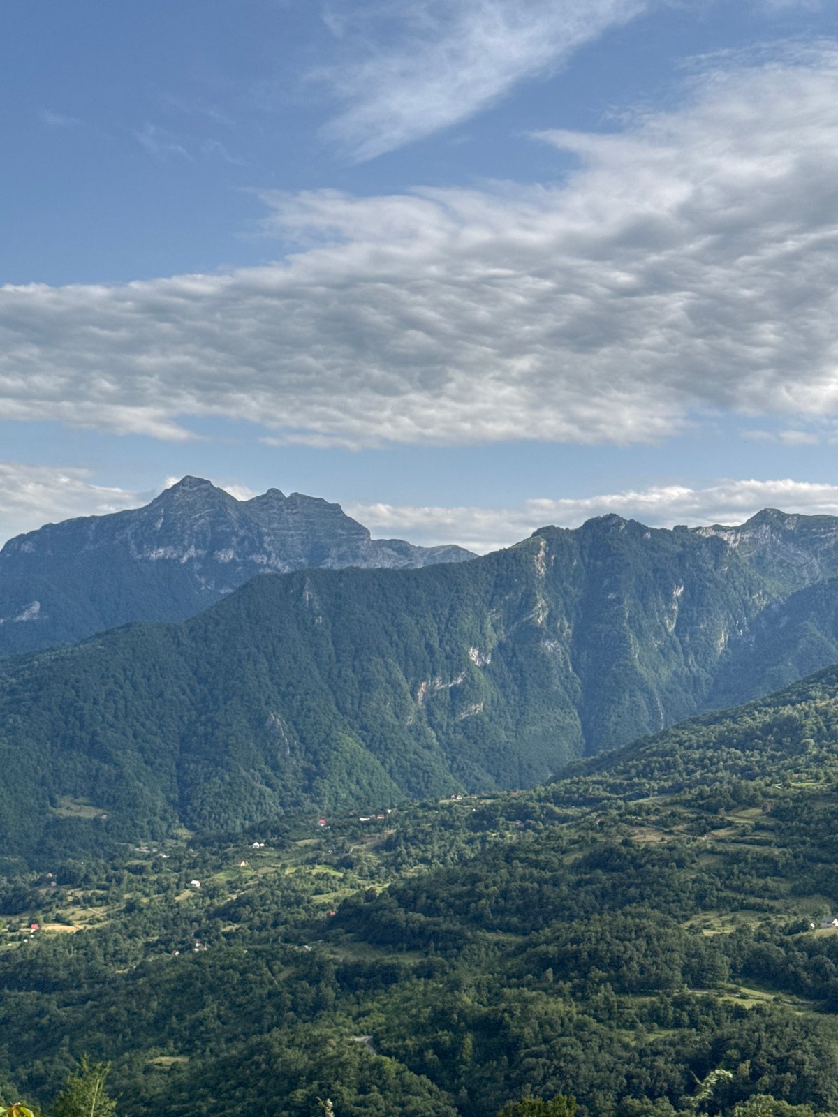 Green hills and valley spread across Montenegro's Dragovića Polje.