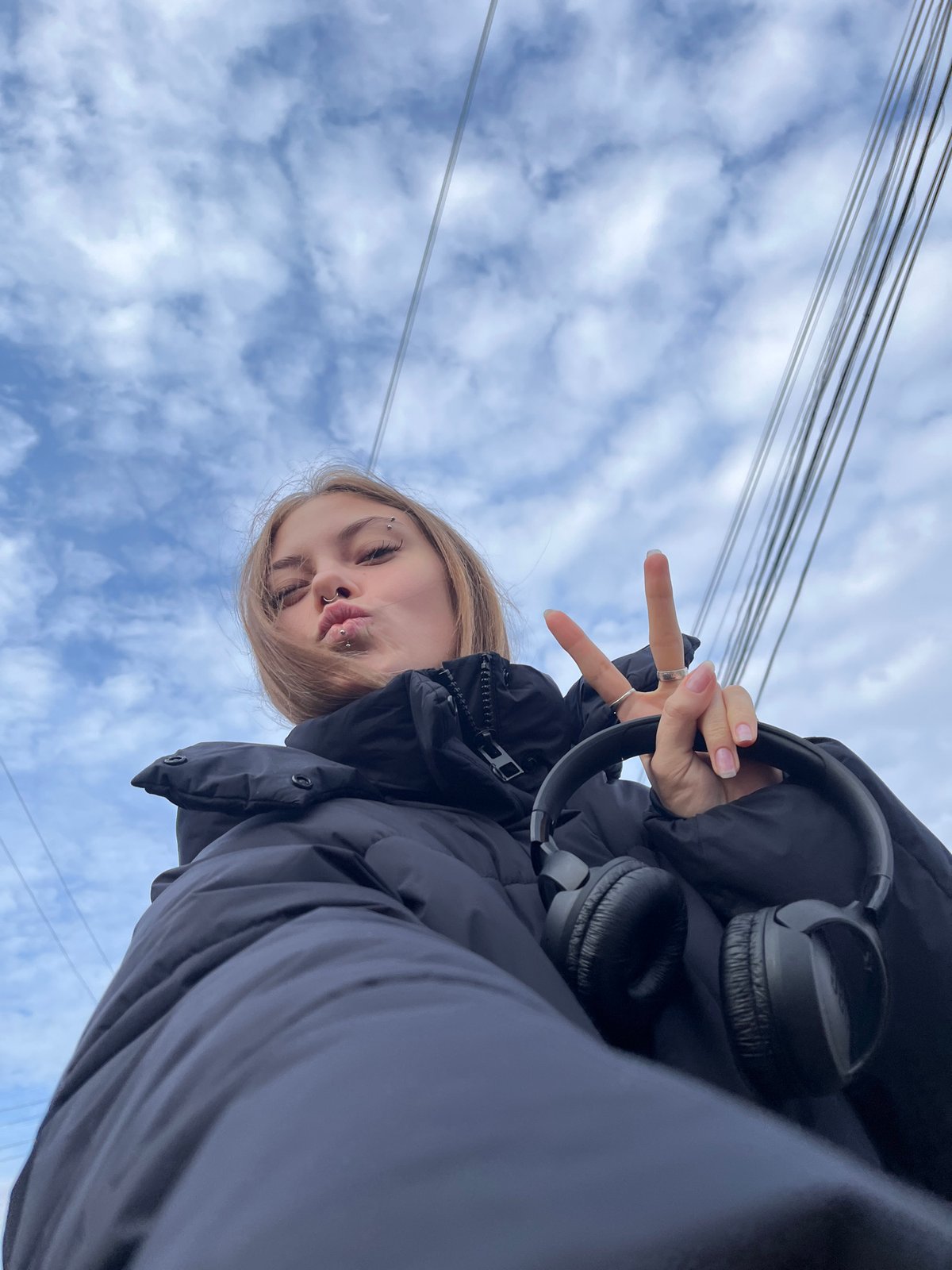 Woman photographed under cloudy skies in Foki, Russia