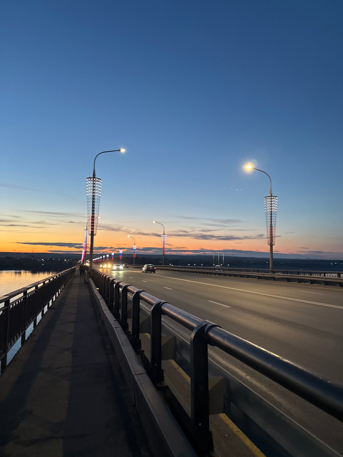 Sunset gathering documented along Perm's Kama River bridges