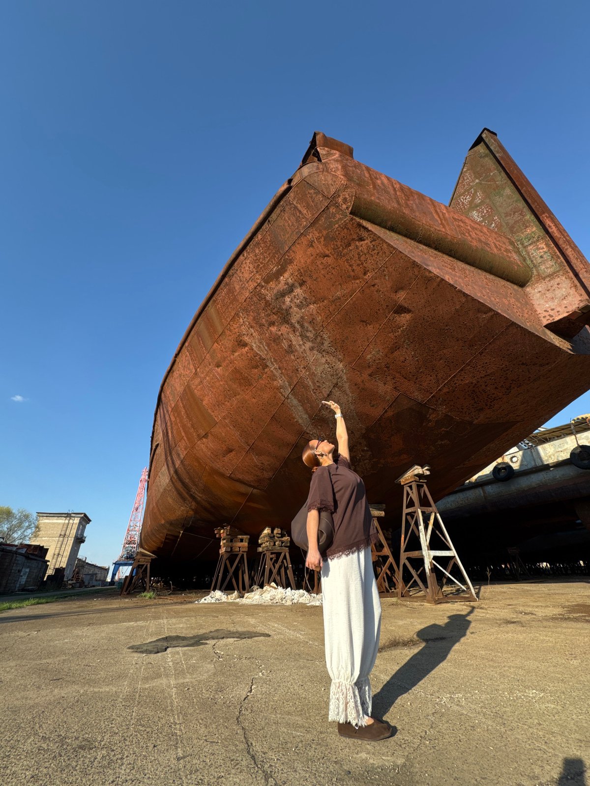 Woman photographed in industrial areas around Chaikovsky, Russia